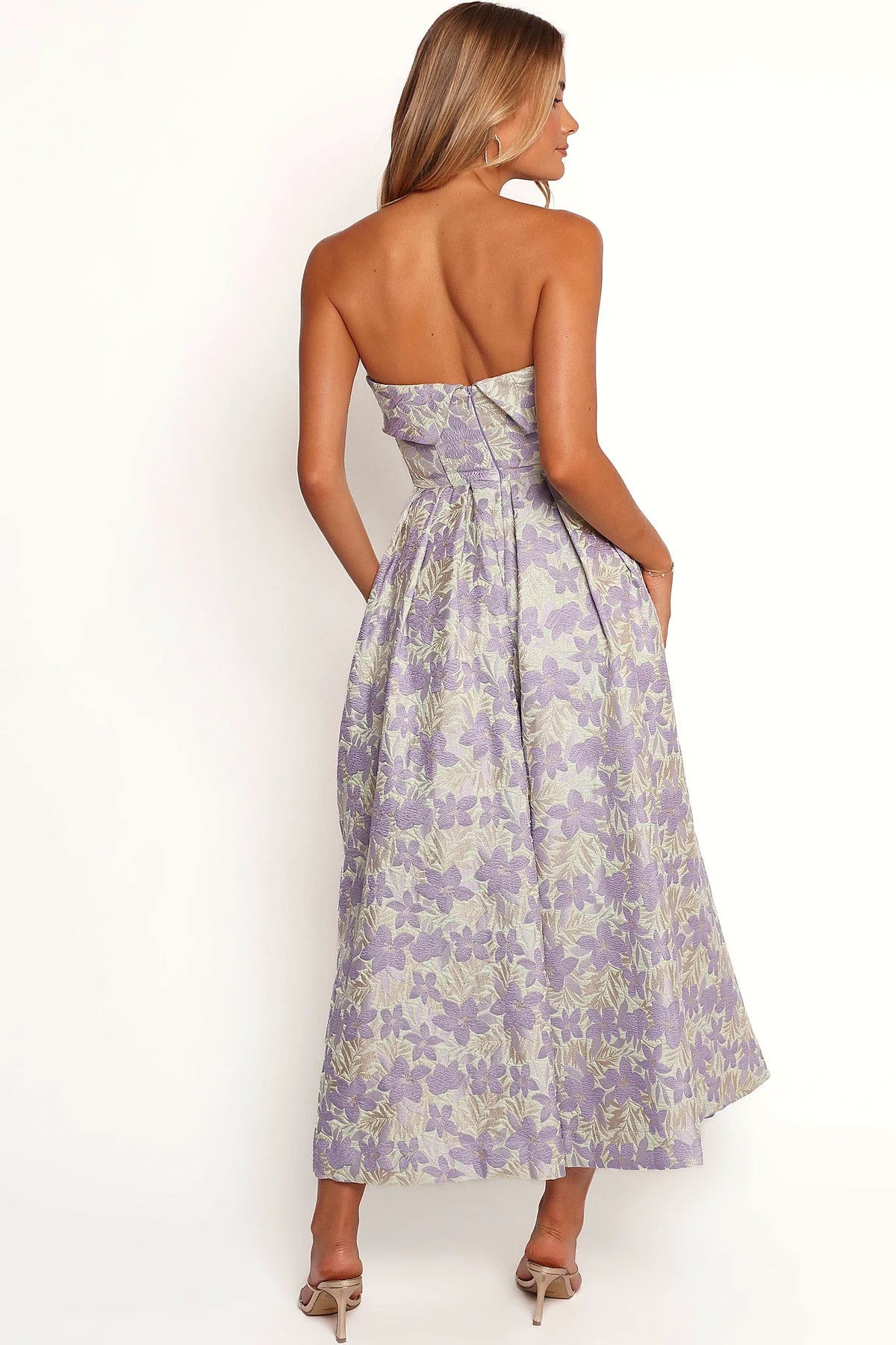 Full length view of a large floral strapless midi dress