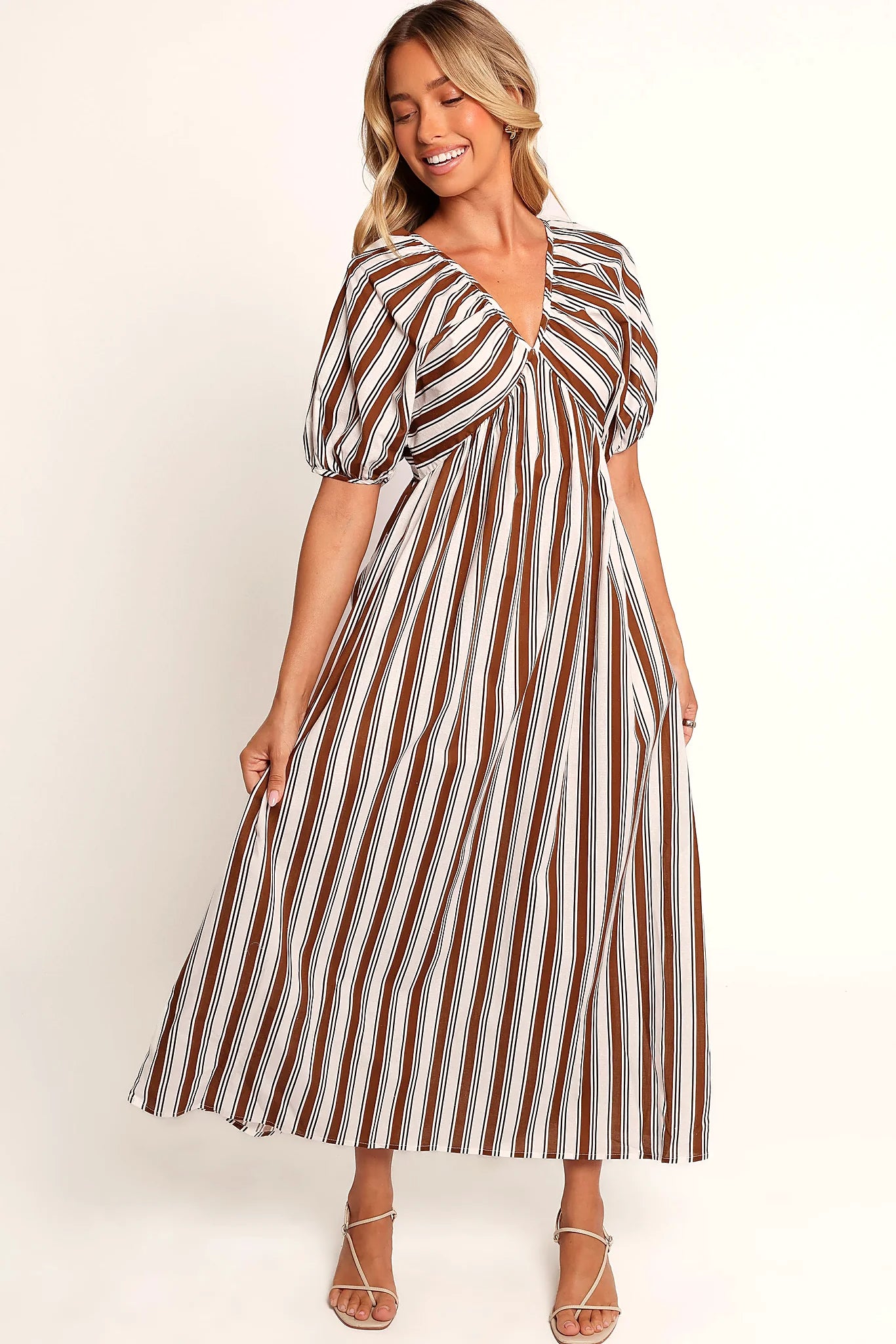Back tie close detail on a chocolate striped maxi dress