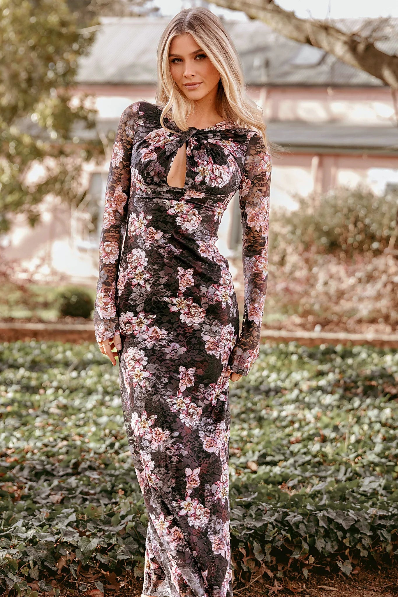 Floral lace maxi dress with a round neckline and twist detail