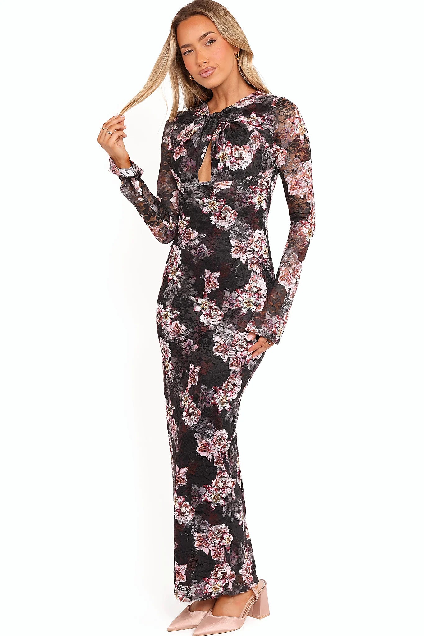 Full length view of a floral lace overlay maxi dress