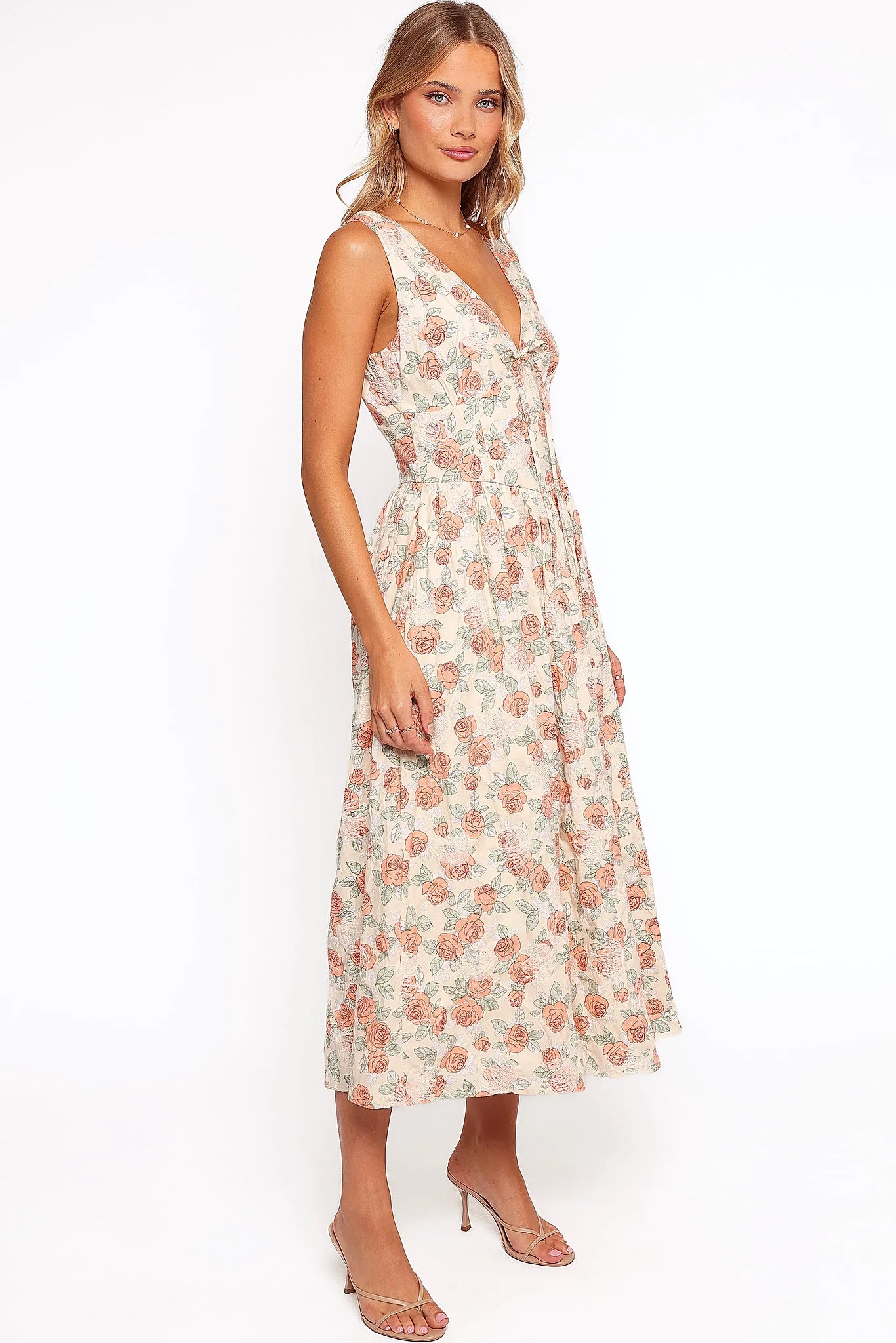 Functional side pocket on a pink floral midi dress