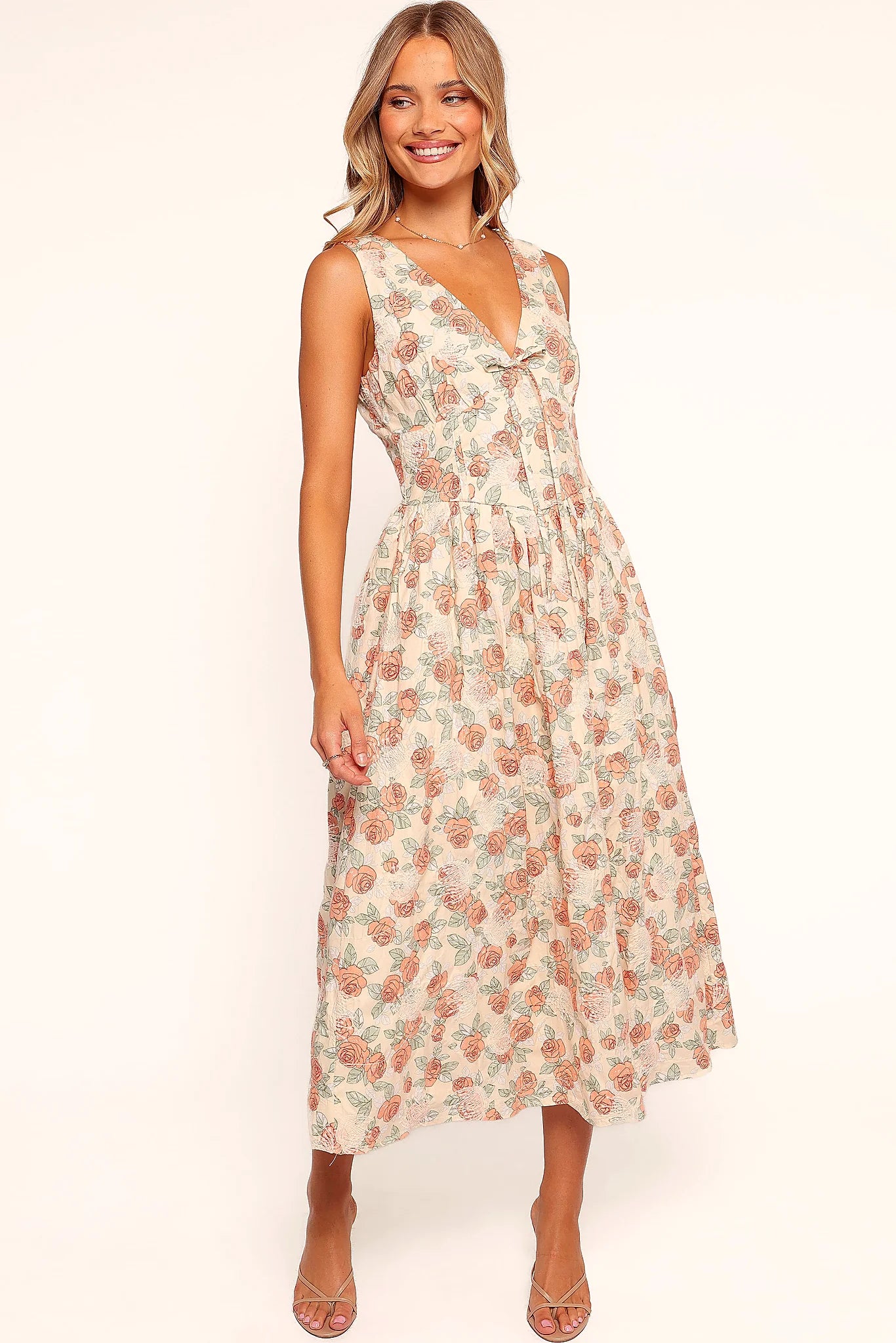 Pink floral midi dress with a V neckline and decorative bust tie