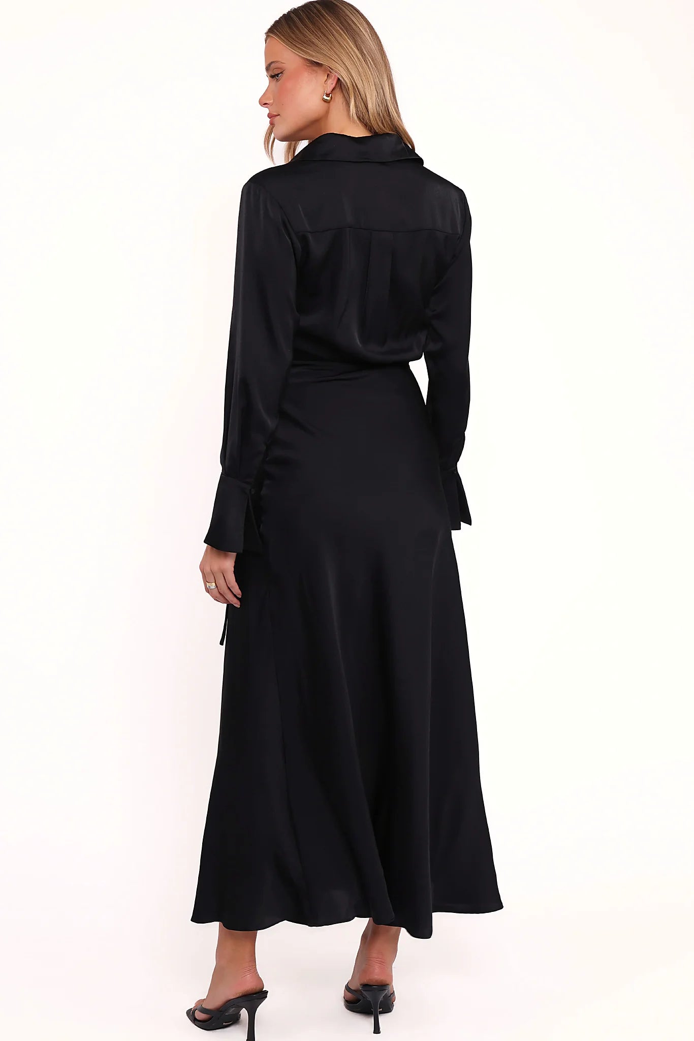 Full length view of a black long sleeve satin maxi dress