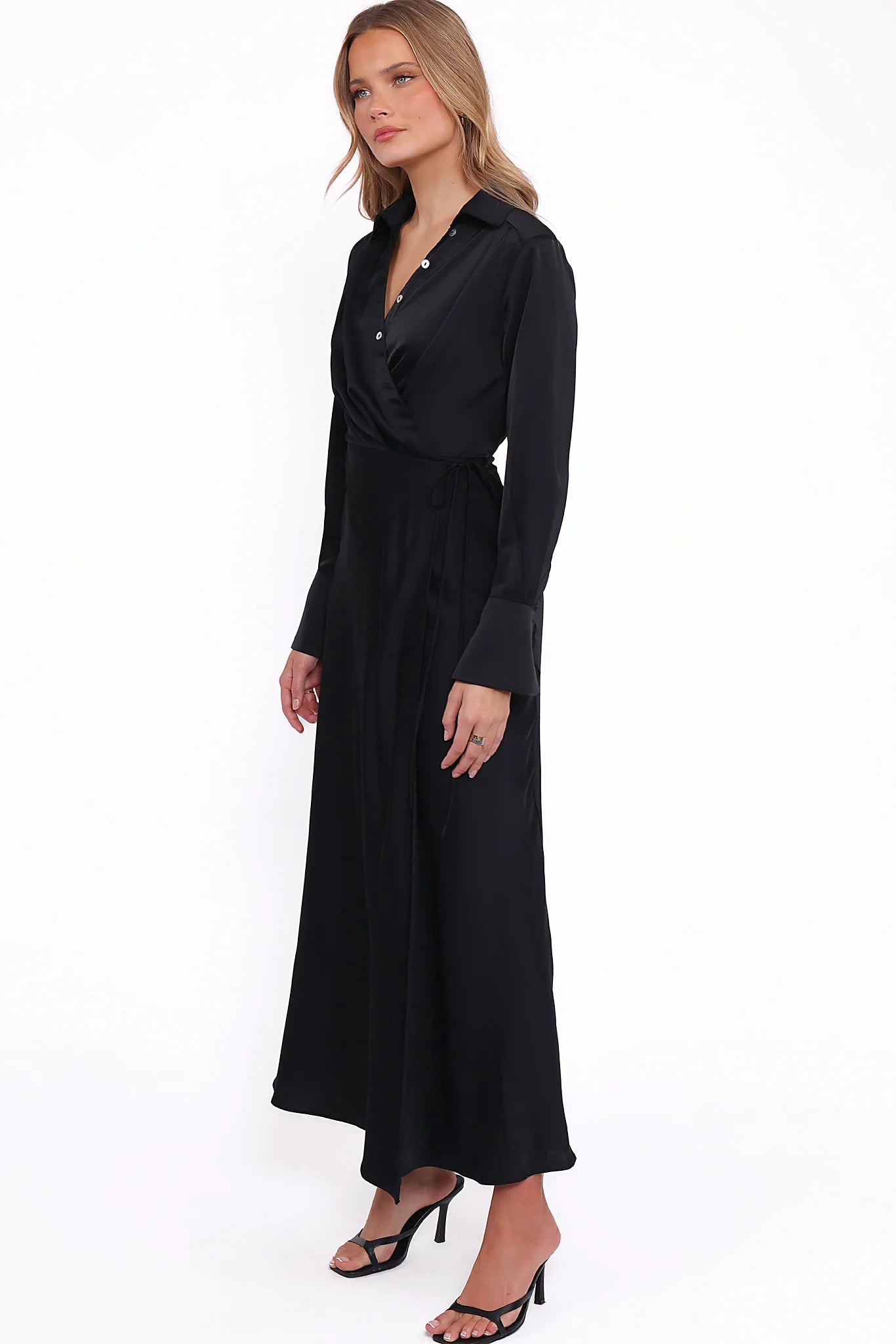 Wrap style skirt with attached waist tie on a black maxi dress
