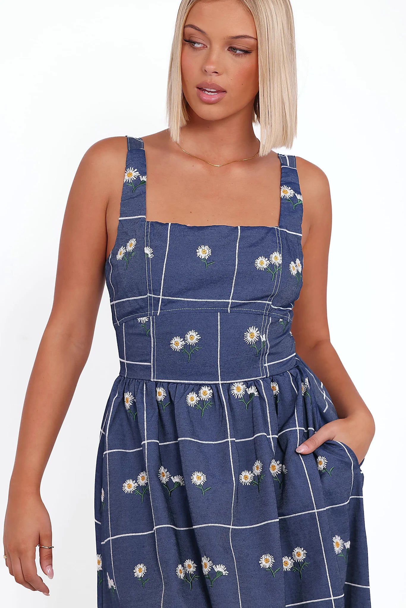Silver back zip on a blue daisy print midi dress