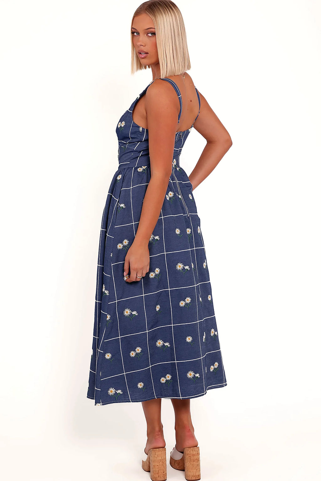 Full length view of a blue daisy print midi dress